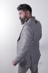 Portrait of a happy South Indian bearded man wearing suit and goggles. Stylish man in different poses and expressions. Coat and pant.