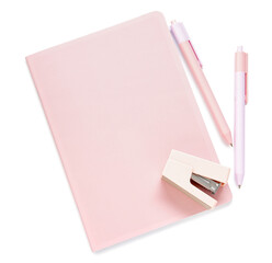 Pink notebook with pens and stapler isolated on white background