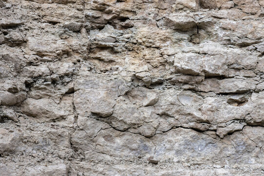 Rough rock wall, natural stone background texture