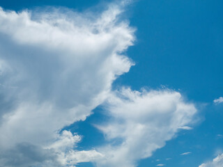 Blue sky fluffy white clouds on summer season bright clear skyline with beautiful cloudscape. Panorama blue sky clouds pattern on daylight with copy space. Cumulus cloudscape air climate sunny day