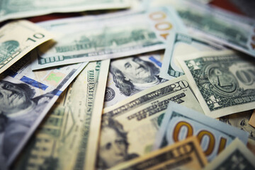 Group of money stack of 100 US dollars banknotes a lot of the background texture. Cash money in a...