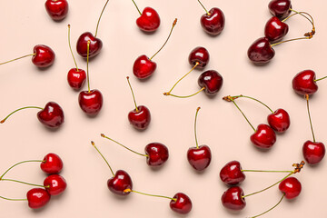 Obraz na płótnie Canvas Red sweet cherries on light pink background
