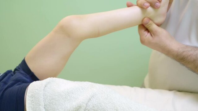 Foot massage for a child with cerebral palsy