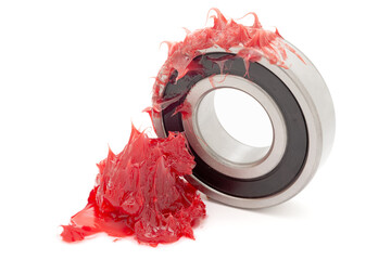 Tapered roller bearing with red lithium grease (Machinery Lubrication). Isolated on white...