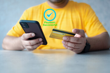 Man using mobile phone for online payment with credit card money transfer successful.