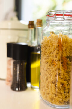 Close up of pasta, oils and spices in kitchen
