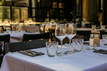 A table white table cloth at an outdoor restaurant in old town or Vieille Ville in Antibes, South...