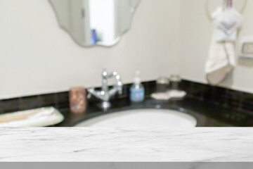 Fototapeta na wymiar Empty white marble table top with blur bathroom background