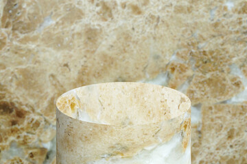 Brown marble podium mockup cylinder shape with marble background for product presentation