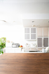 ダークブラウンのテーブルがあるキッチンの背景素材