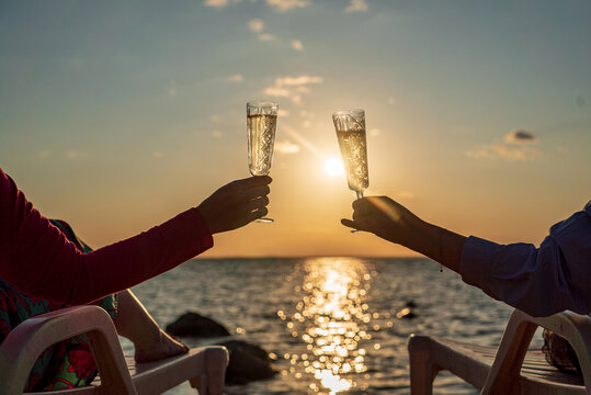 Couple Drinking Champagne Near Sea