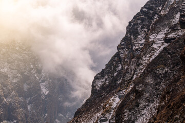 Machhapuchhre Peak, the sunrise area of annapurna base camp, Nepal, is a very beautiful peak of the Himalayas. snow capped peaks photo from a distance The red-orange morning sun shines brightly.