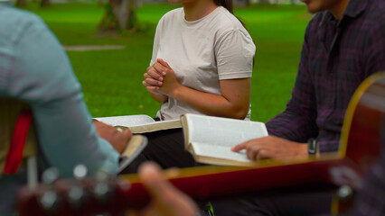 Christian groups praying with Holy Bible. and play guitar to sing worship thanksgiving praise,...