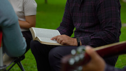 Men are reading the Holy bible. And befriends playing guitar, The books of the Bible, Concepts of...