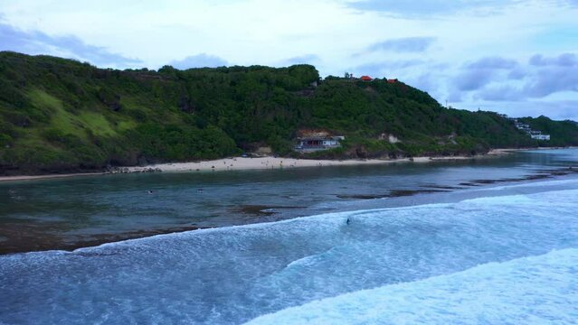 Foamy Waves Over The Sea Of Gunung Payung Beach Near Pandawa Beach In Kuta Selatan, Bali Indonesia. Aerial Pullback