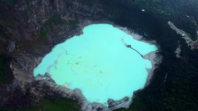 Kawah Putih - sulfur rich volcanic crater lake in Ciwidey, Bandung, West Java, Indonesia - aerial drone shot