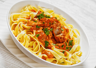 Creamy Paprika Pork Chunks over tagliatelle noodle