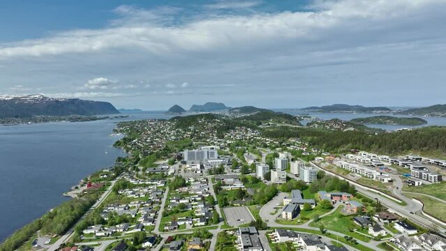 Forward moving aerial towards Gaaseid, Hatlane and Ratvika before Alesund Norway - Summer aerial