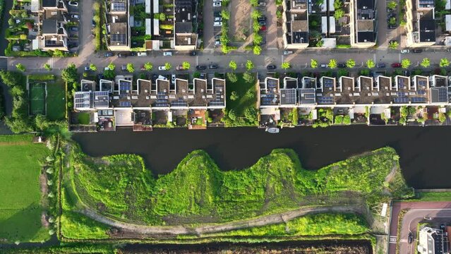 Weesp residential development on waterways with lush natural vegetation, aerial