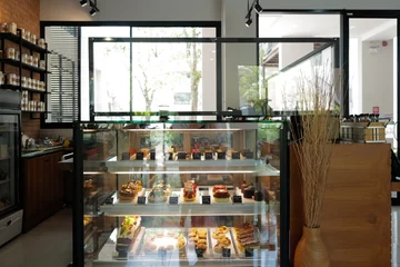 Foto op Plexiglas Interior architecture and decoration at local coffee cafe, European restaurant and specialty bakery and pastry shop decorated with wooden furniture © chettarin