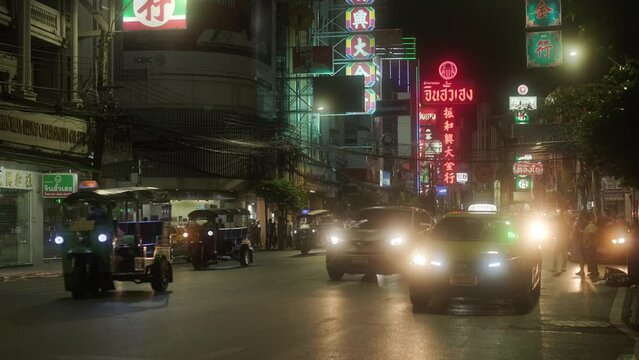 Bangkok, China Town street at night. Rickshaws, people, neons, night, nightlife, urban, bustling, vibrant, cultural, traditional, lanterns, street food, markets, alleys, asian culture, night markets