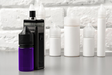 Refill liquid for electronic cigarettes against brick wall background