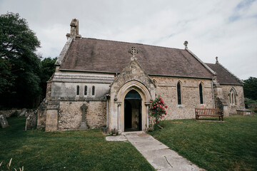 An old church in a town with a garden entrance