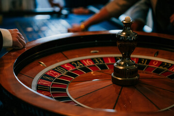 Roulette wheel and chips in casino