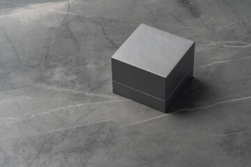 Small jewelry box on gray background close up