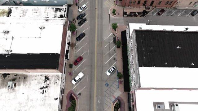 Intersection in downtown Elkhart, Indiana with drone video tilting up.