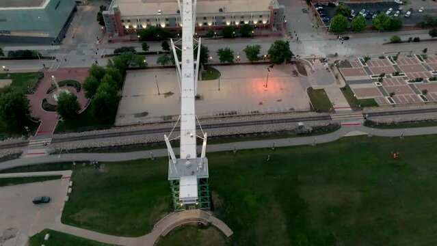 Downtown Davenport, Iowa skyline during sunset with drone video tilting up.