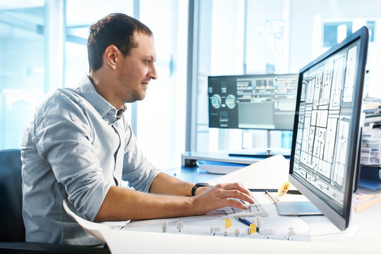  Engineer working on a computer in office. In Architectural Bureau: Architect and Engineer Working on a Prototype Project. Image created with Generative AI technology