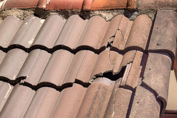 Damaged old roof tile in need of repair. © toa555