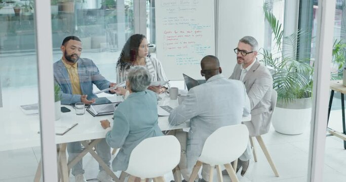 Workshop, ideas and meeting with business people at table for feedback, brainstorming or performance review. Planning, team and discussion, men and women in modern office, schedule or project agenda.