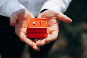 businessman holding a house