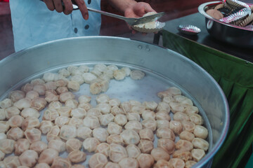 Nepalese steamed dumpling momo serving at the party. Close up image.