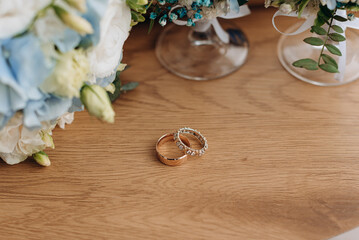 Fototapeta na wymiar wedding rings on wooden table