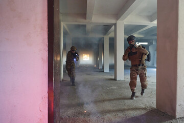 A group of professional soldiers bravely executes a dangerous rescue mission, surrounded by fire in...