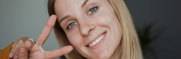 Banner, girl smiles and gestures to show class