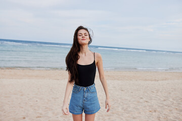 Fototapeta na wymiar vacation woman sunset sea travel summer beach young smile running lifestyle