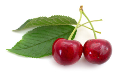 Sweet cherries with stem and leaves.