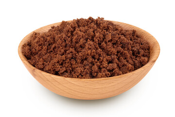 Dark muscovado sugar or Barbados sugar in wooden bowl isolated on white background