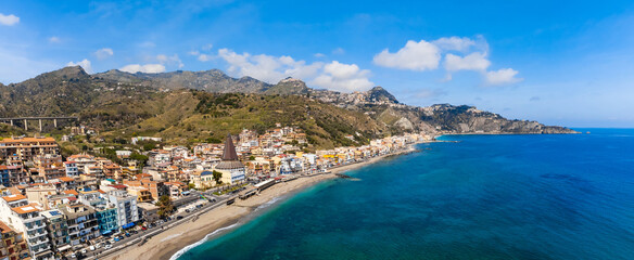View with Giardini Naxos and Taormina, Sicily. Beach and sea in summer - obrazy, fototapety, plakaty