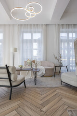 spacious open-plan apartment with stylish modern bright design, dressing area, bedroom, living room and bathroom on a sunny day