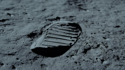 Lunar astronaut walking on the moon's surface and leaves a footprint in the lunar soil. 3d rendering. Some Elements of this video furnished by NASA.