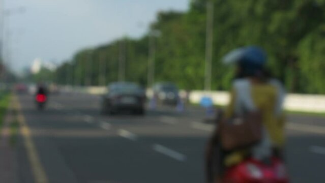 9th July, 2023, Kolkata, West Bengal, India: POV of a bike rider of morning traffic movement on Red Road and beautiful cityscape of Kolkata.