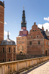 Obraz premium Summer, sunny and warm view of Hillerod Castle in Denmark. There is a beautiful garden around the castle and it is worth visiting this place while in this area.