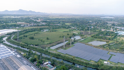 Solar cells farming beside with rivers and factories in industrial area. Green World concept with the ecosystem with technology recycling.