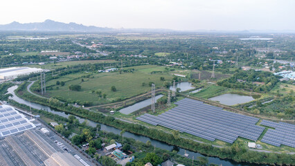 Solar cells farming beside with rivers and factories in industrial area. Green World concept with the ecosystem with technology recycling.