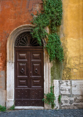 Fototapeta na wymiar Old vintage wooden door in Rome